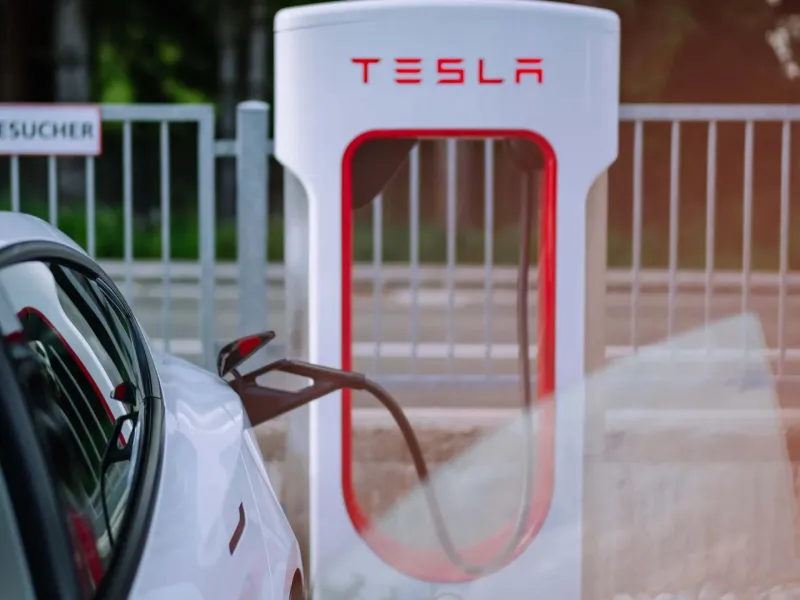 An electric vehicle connected to a charging station